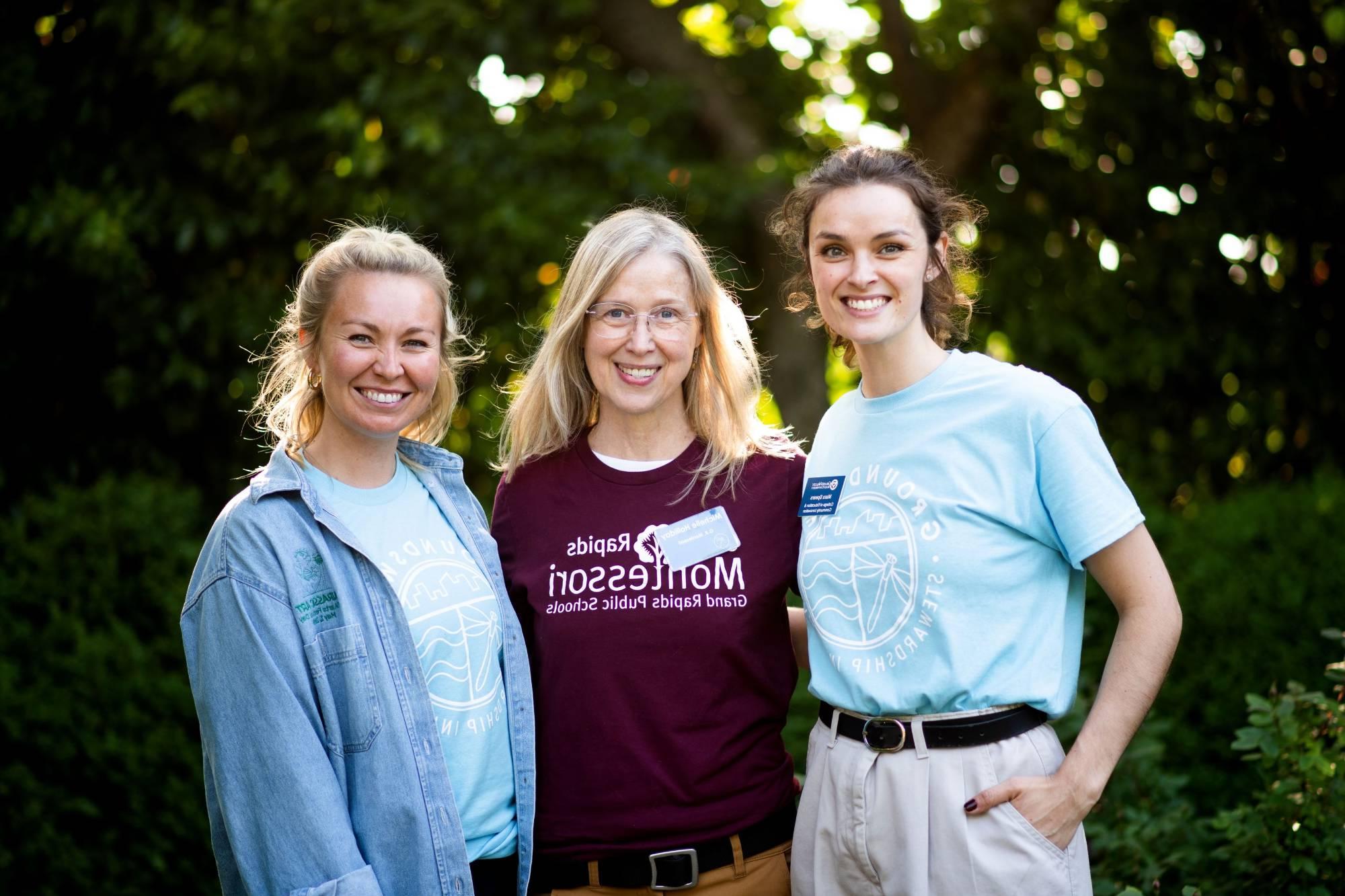 Two Groundswell staff members smiling with a the Groundswell Swell Teacher of the Year